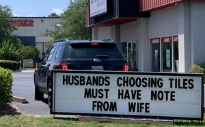 Sign that reads "husband choosing tiles must have note from wife"